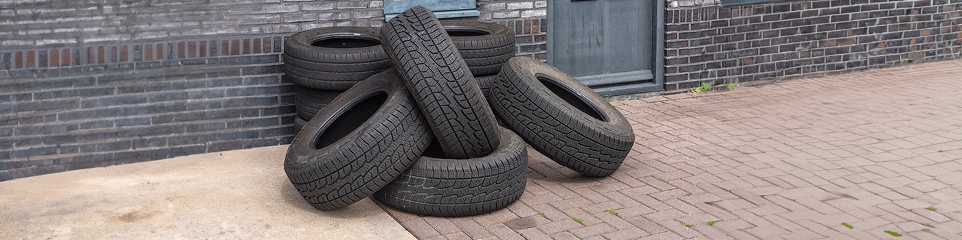 Tyres in a pile that need disposal or recycling